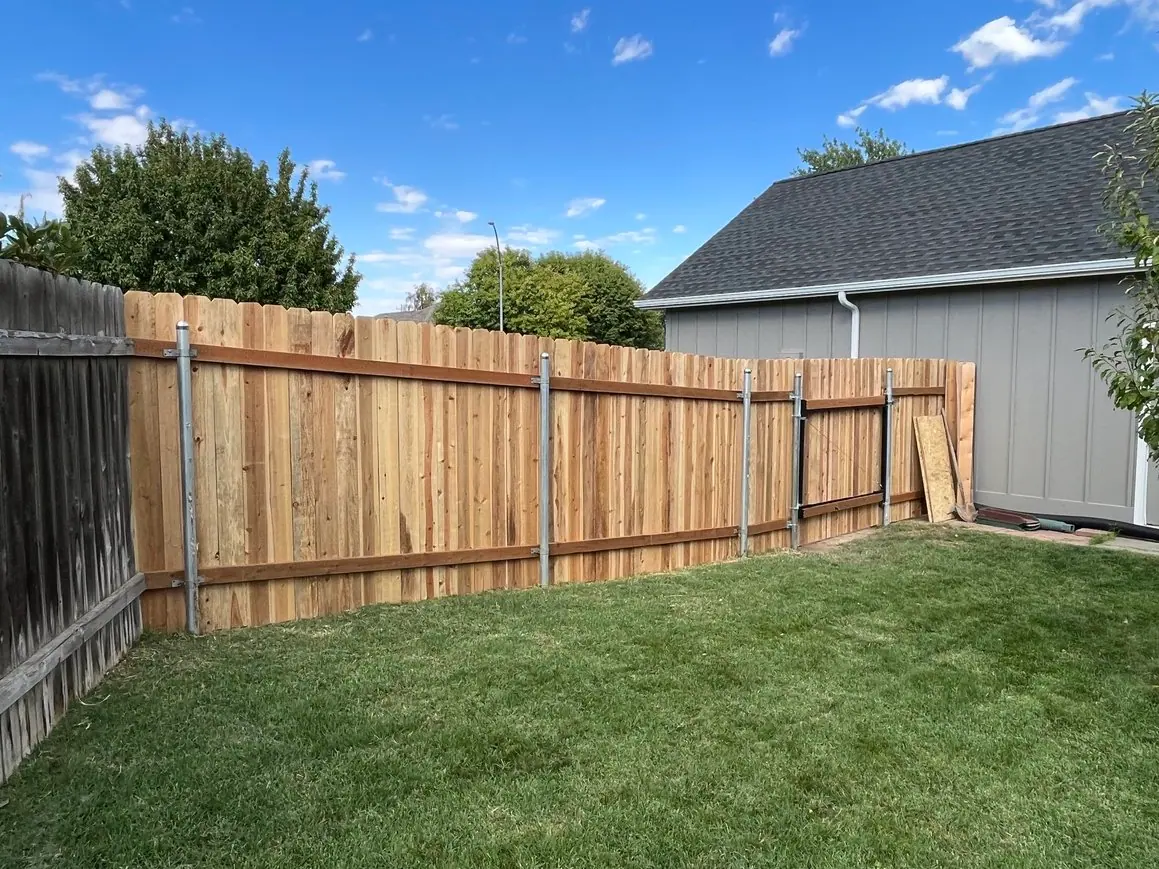 Cedar fence along a lawn